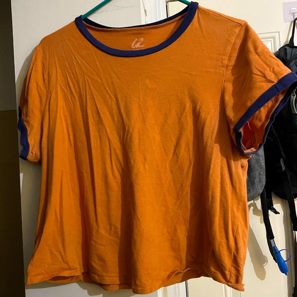 Orange with a blue trim tee